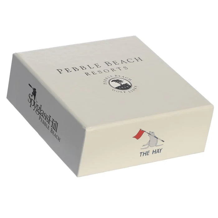 Beige box with Pebble Beach Resorts, Spyglass hill, and The Hay golf course branding on a white background