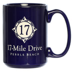 Navy blue mug with '17-Mile Drive Pebble Beach' design on a white background