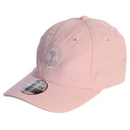 Pink cap with a white pebble beach logo on a white background