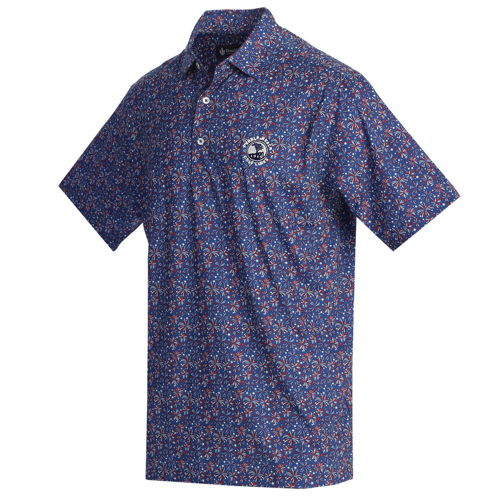 Blue patterned polo shirt with a pebble beach logo on the chest on a white background