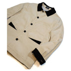 Beige jacket with black accents on a white background