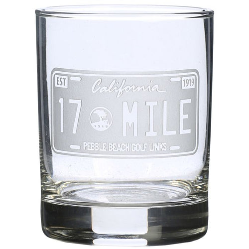 Rocks glass with engraved California 17 Mile Drive license plate design on a white background