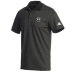 Black patterned polo shirt with Adidas logo on the sleeve and a Pebble Beach logo on the chest on a white background