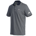 Navy patterned polo shirt with an Adidas logo on the sleeve and a Pebble Beach logo on the chest on a white background