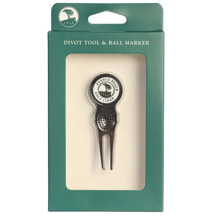 Golf divot tool and ball marker with pebble beach golf links logo in packaging on a white background.
