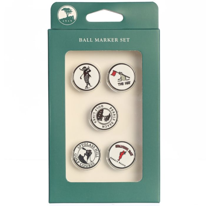 Set of five golf ball markers Delmonte golf, The Hay golf, pebble beach golf links, Spyglass hill and Spanish bay gold links in packaging with visible brand logo on a white background.
