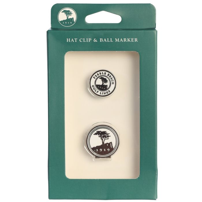 Hat clip and ball marker with pebble beach golf links logo set in green packaging with visible brand logo on a white background.