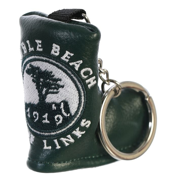 Green leather golf club head cover keychain with embroidered pebble beach logo on a white background