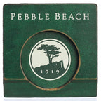 Green wooden putting cup with 'pebble beach' text and logo on inside on a white background.
