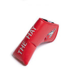Red blade golf club head cover with 'The Hay' branding and Cynthia the sea lion on the side on a white background.