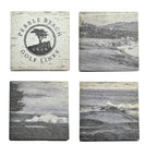Set of four grey wooden coasters with Pebble Beach Golf Links logo and golf course images.