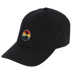 Black cap with a colorful sunset and a pebble beach logo on a white background
