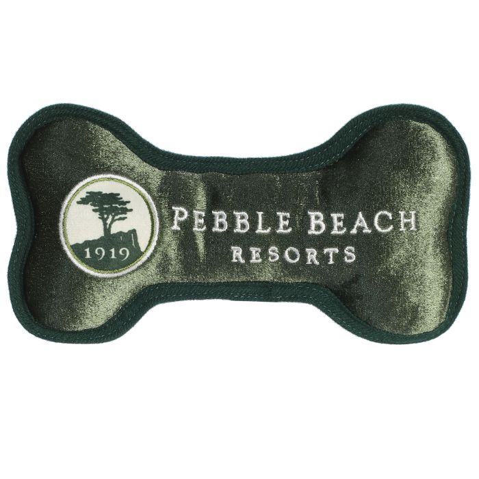 Green bone-shaped toy with Pebble Beach Resorts logo on a white background