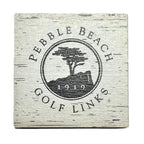 Pebble Beach Golf Links logo on a wooden coaster with a white background