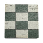 Checkered patterned coaster with green and beige squares on a white background