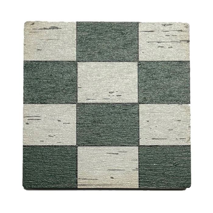 Checkered patterned coaster with green and beige squares on a white background