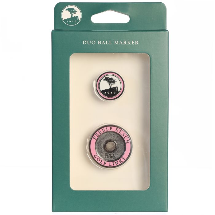Pink golf ball marker duo with pebble beach golf links log in a green packaging box with visible brand logo on a white background.