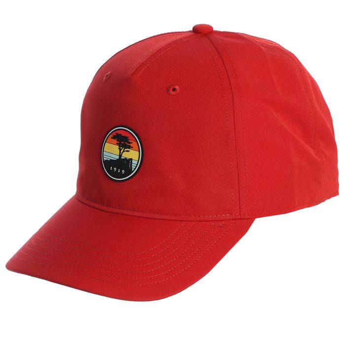 Red cap with a colorful sunset patch featuring a pebble beach logo on a white background