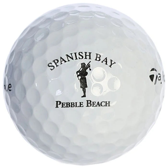 White golf ball with 'Spanish Bay Pebble Beach' branding on a white background
