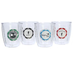 Four clear tumblers a green pebble beach golf links, blue spyglass hill, black del monte golf, and a red Spanish bay poker chip logos on a white background