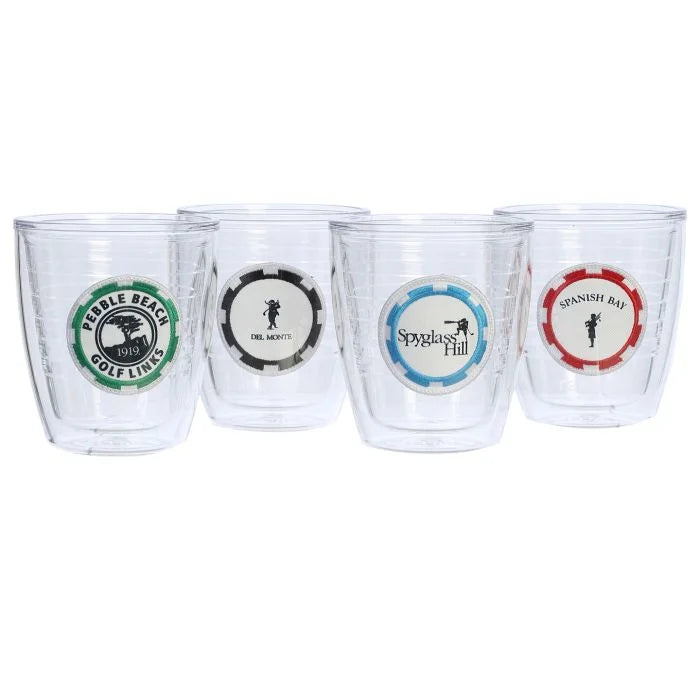 Four clear tumblers a green pebble beach golf links, blue spyglass hill, black del monte golf, and a red Spanish bay poker chip logos on a white background