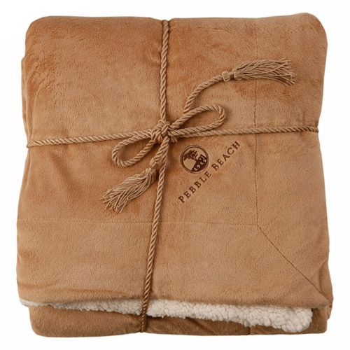 Brown sherpa blanket with a 'Pebble Beach' logo on a white background