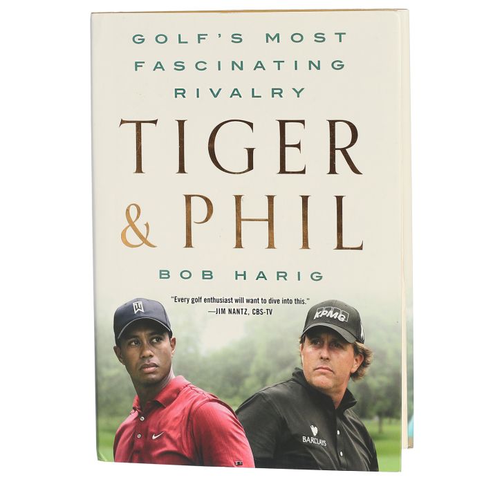 Book cover of 'Tiger & Phil' by Bob Harig featuring images of Tiger Woods and Phil on a golf course.