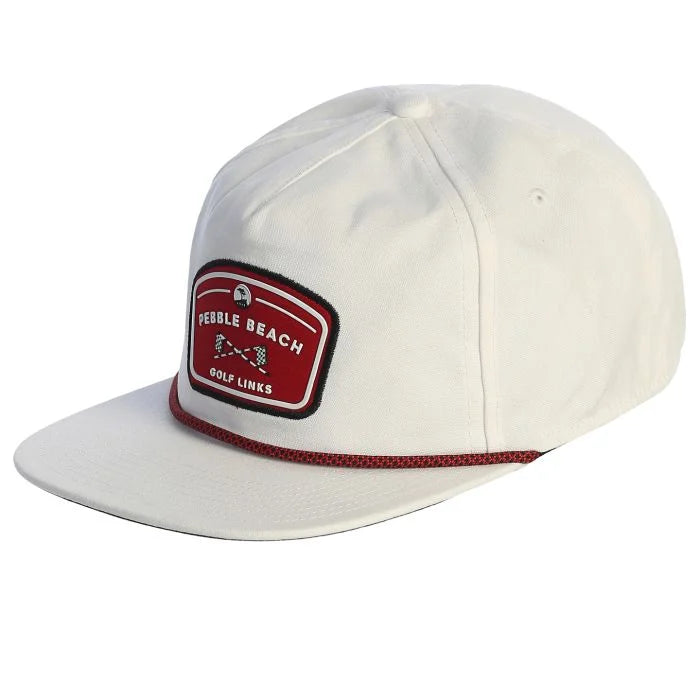 White cap with a red and black pebble beach golf links patch and a red rope on a white background 