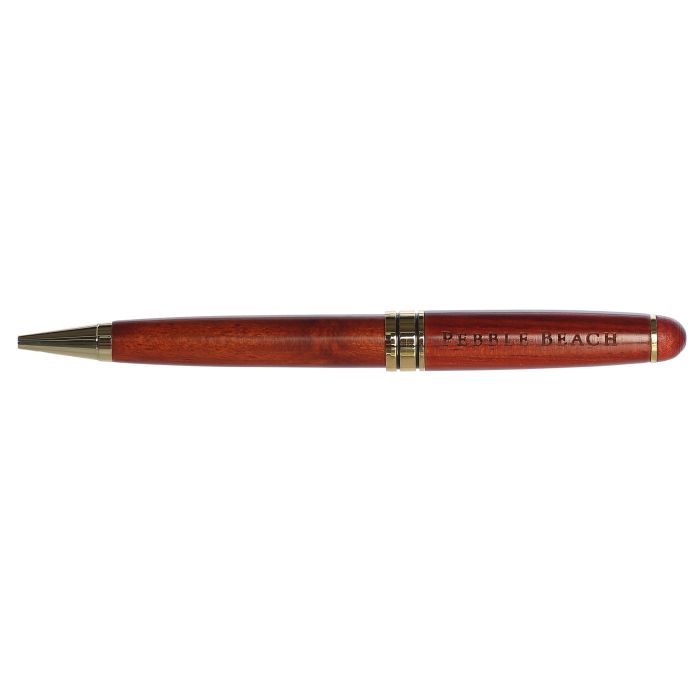 Wooden pen with gold accents and a text 'pebble beach' on a white background